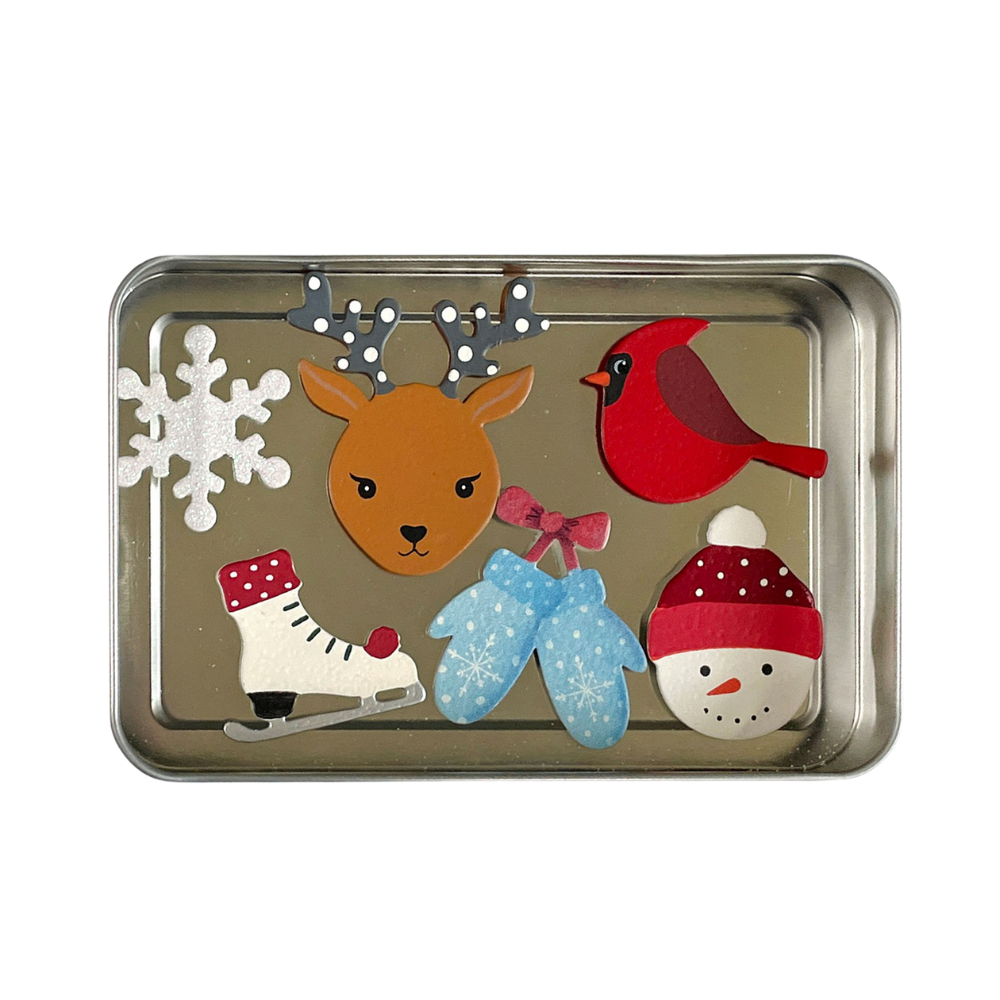 Holiday magnets on a metal tray