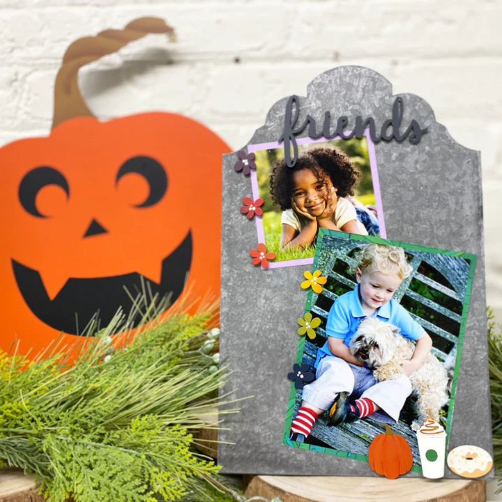 Metal memo board with pumpkin spice magnets and photos of a girl and a boy. 