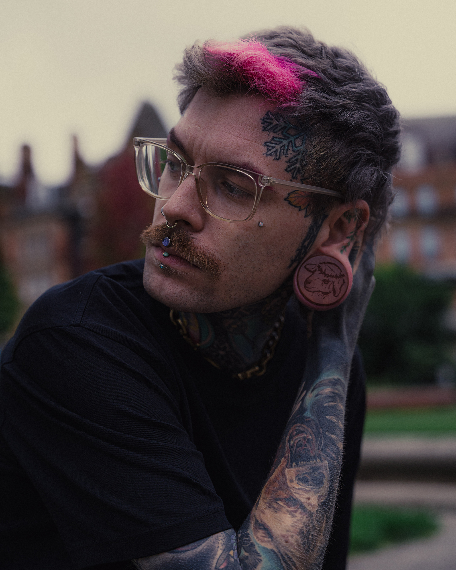 Alternative Tattooed man wearing  Sacrificial Lamb Plug / Gauge - Saba Wood | Flat Faced Double Flare