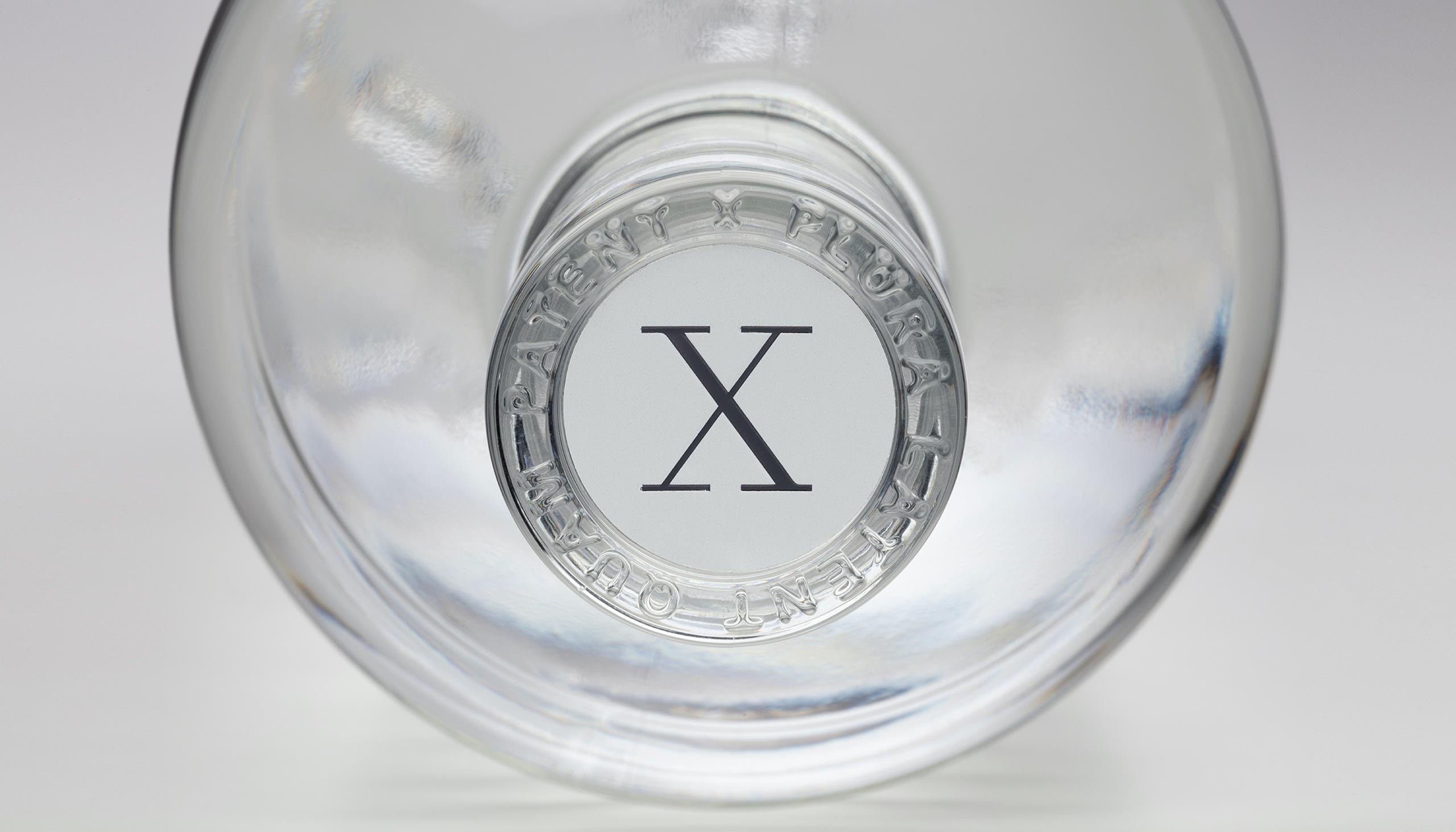'X' bottle cap on the top of our bottles