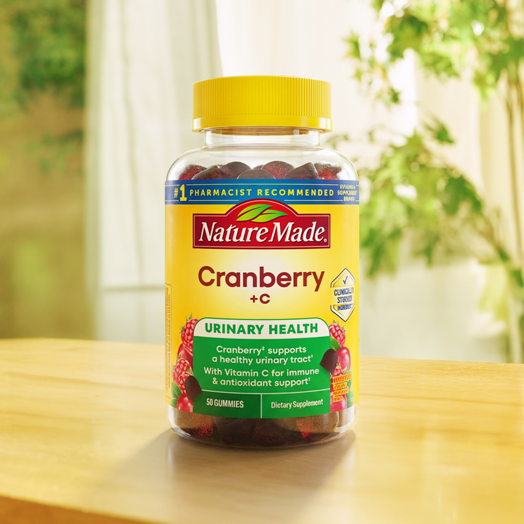 Nature Made Cranberry + C gummy vitamins displayed on kitchen counter.
