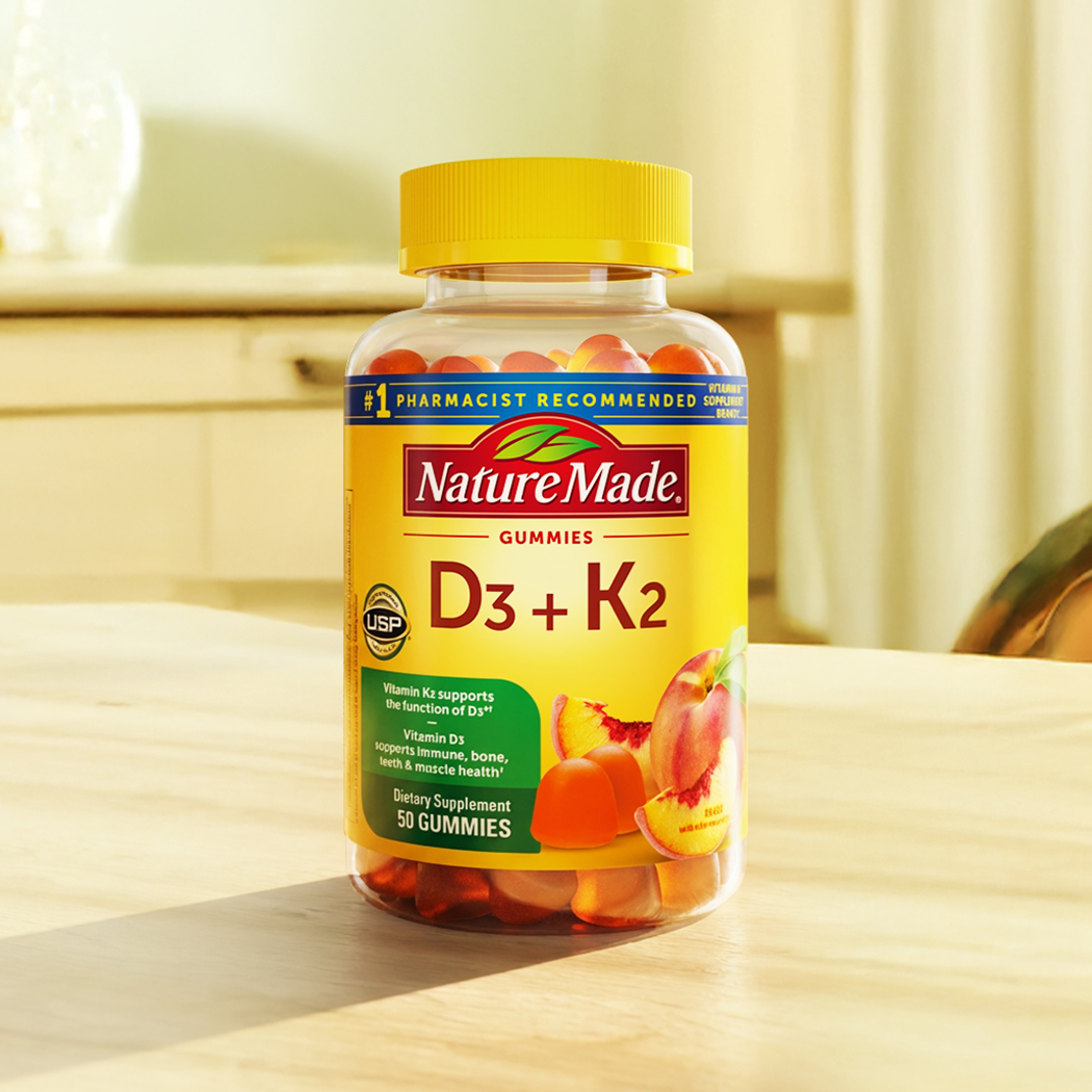 Nature Made Vitamin D3 + K2 gummies displayed on countertop.