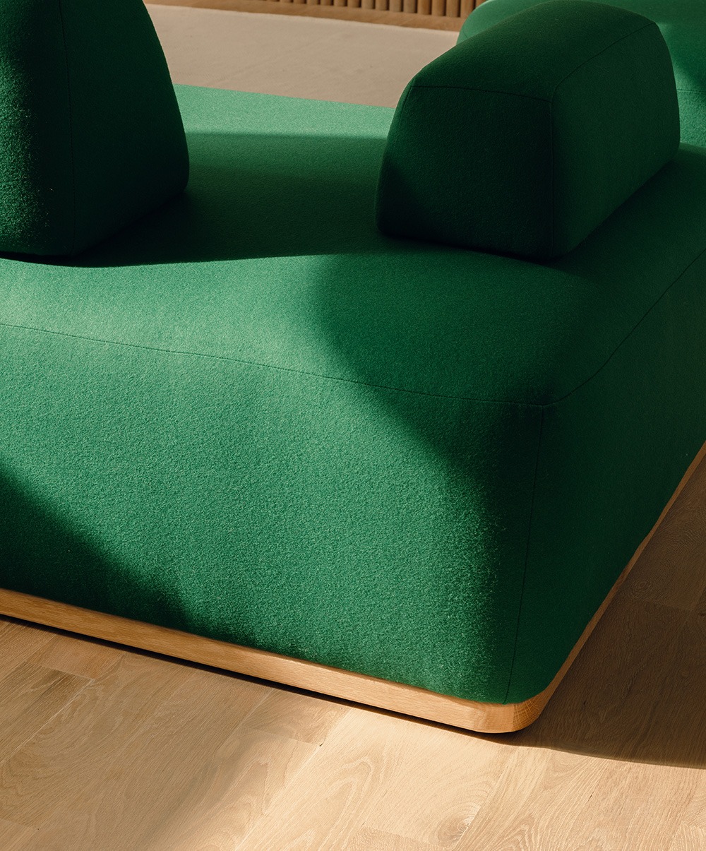 Image: Green Floyd Magna sectional in a brightly lit room with wood floors