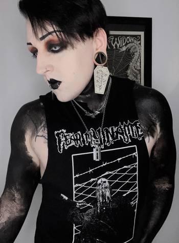 Alternative Tattooed man wearing Gold Dead Flowers Coffin Dangle Plug Earrings