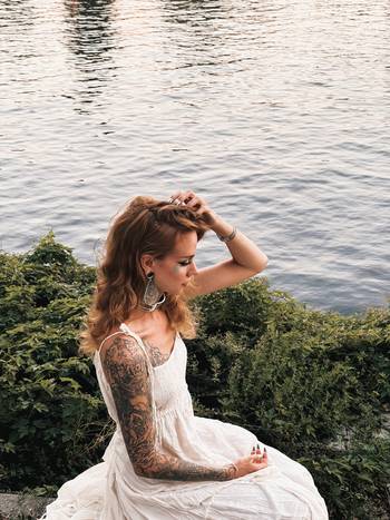 Woman wearing unique Clear Acrylic Peony Teardrop Dangle Plug Earrings