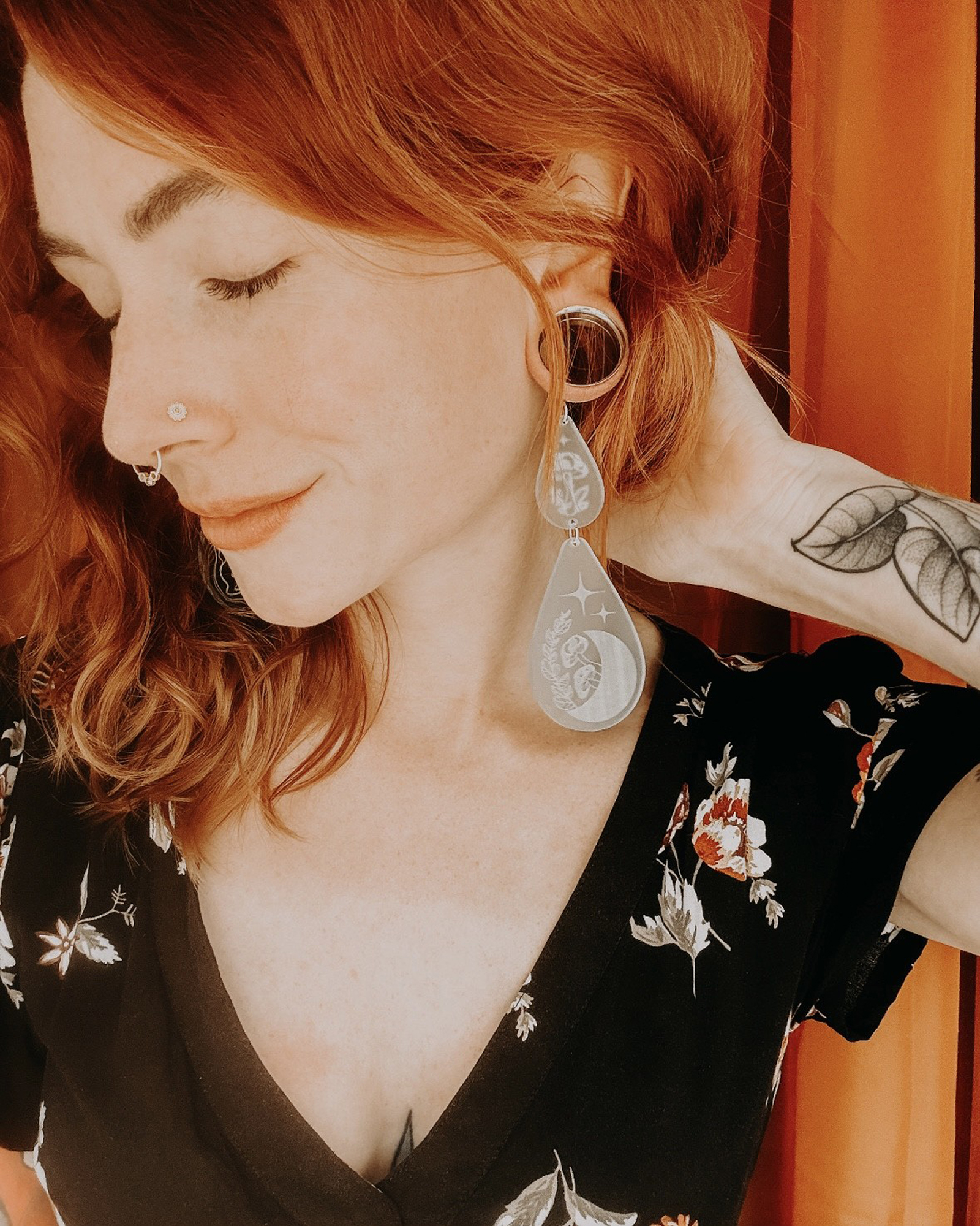 Woman wearing unique  Frosted Acrylic Mush-Moon Double Teardrop Dangle Plug Earrings