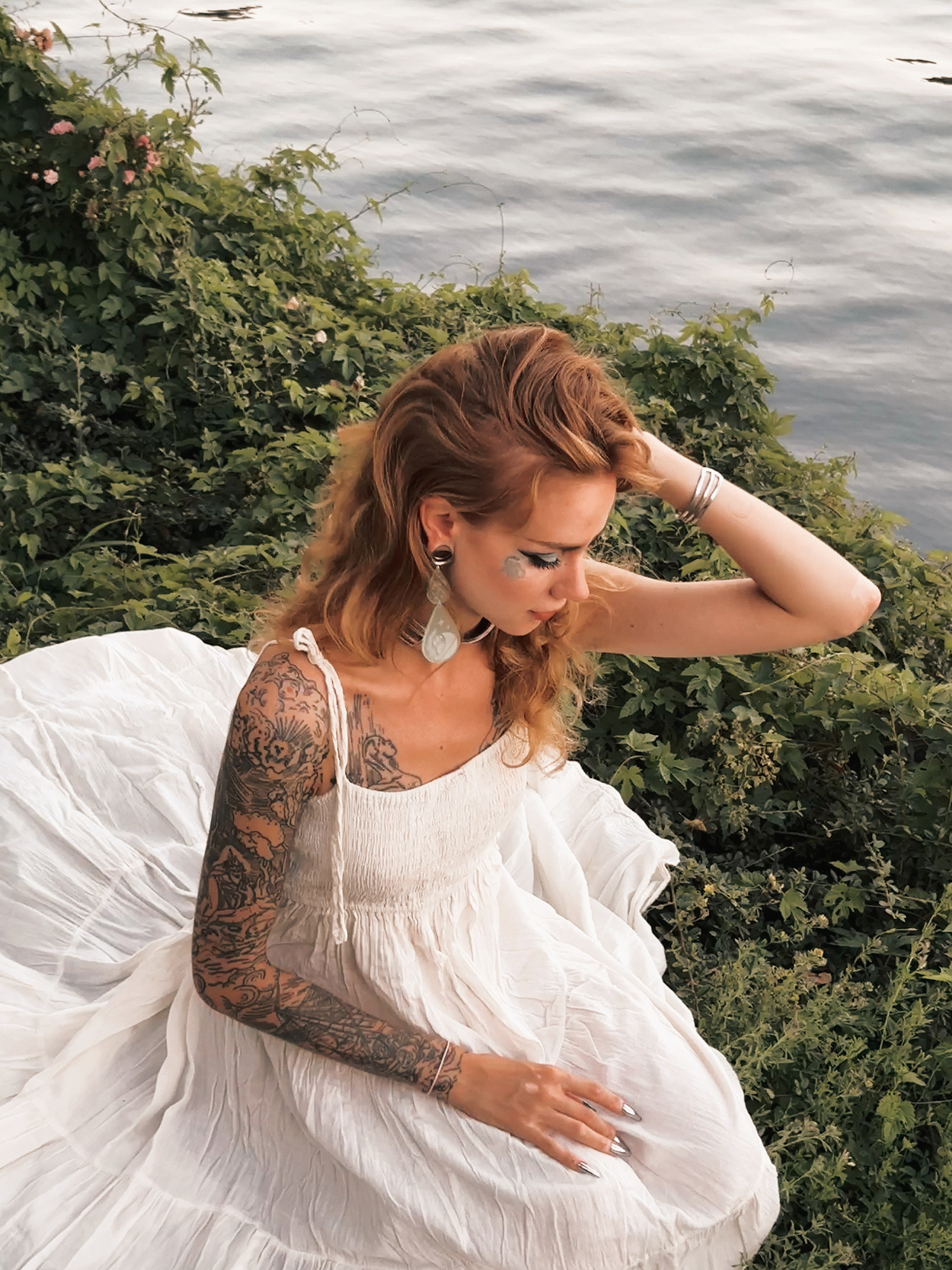 Alternative Tattooed woman wearing  Frosted Acrylic Mush-Moon Double Teardrop Dangle Plug Earrings