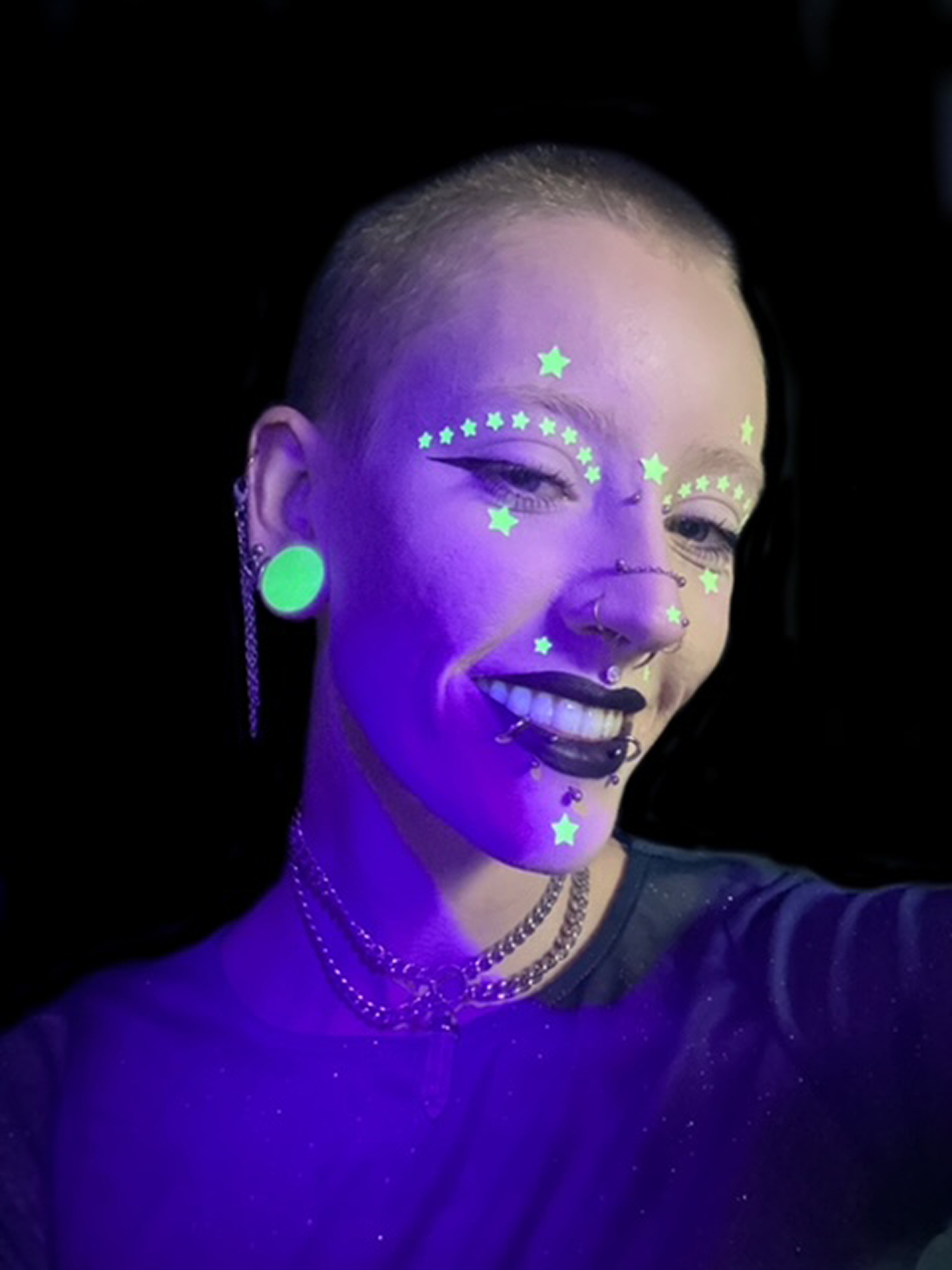 Alternative Woman Wearing  Glow in the Dark Double Flare Stone Plug / Gauge