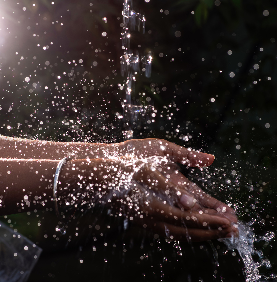 water falling on hands