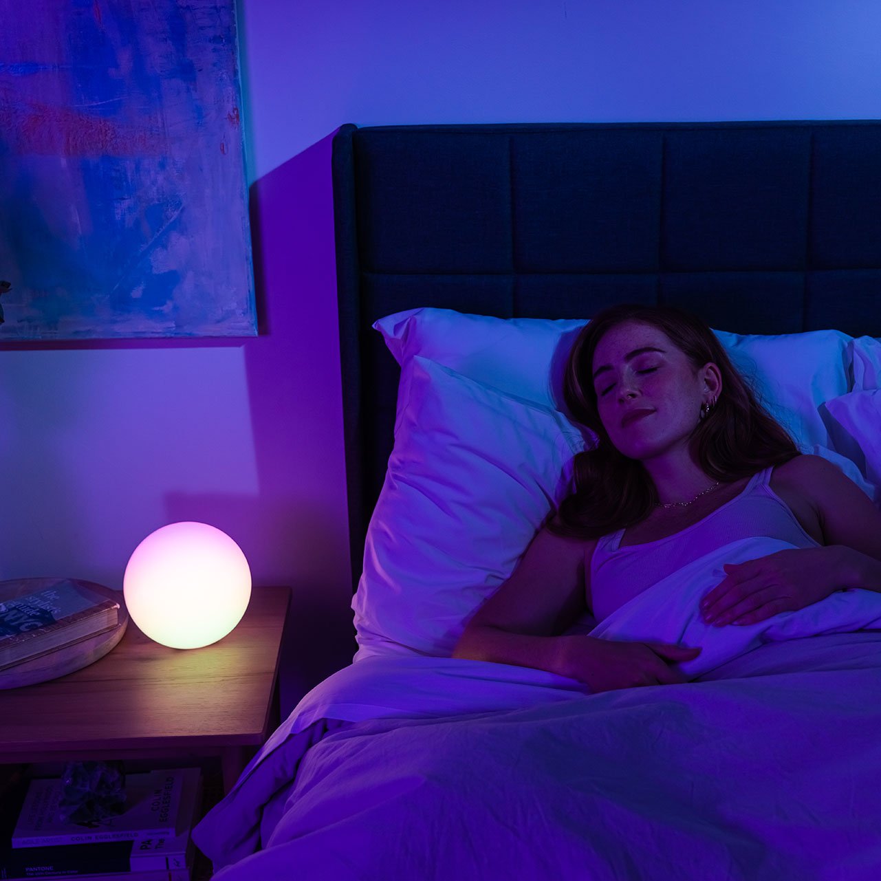 woman sleeping next to blissradia smart mood light
