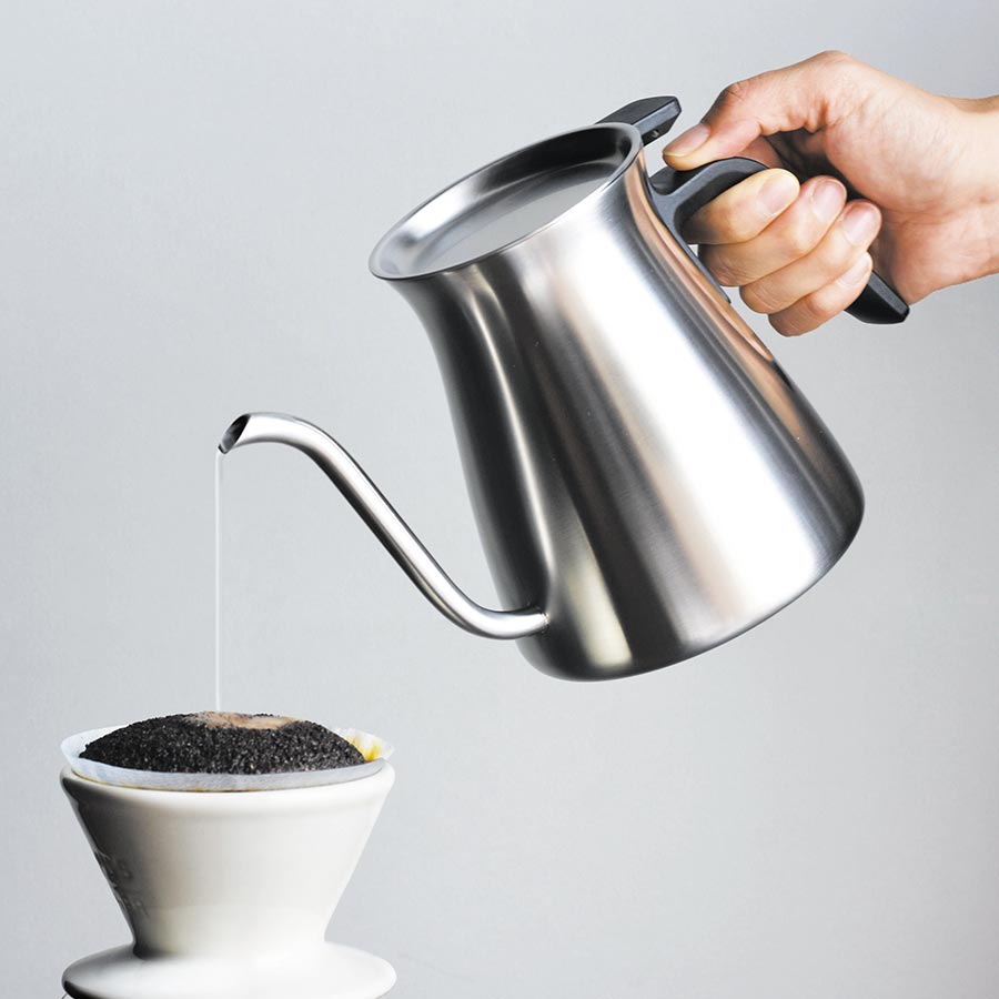  POUR OVER KETTLE pouring water into a coffee brewer  