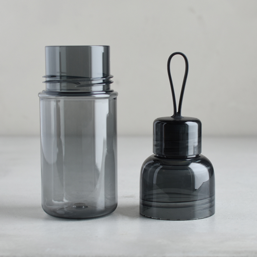  WORKOUT bottle smoke with lid off and placed next to the bottle  