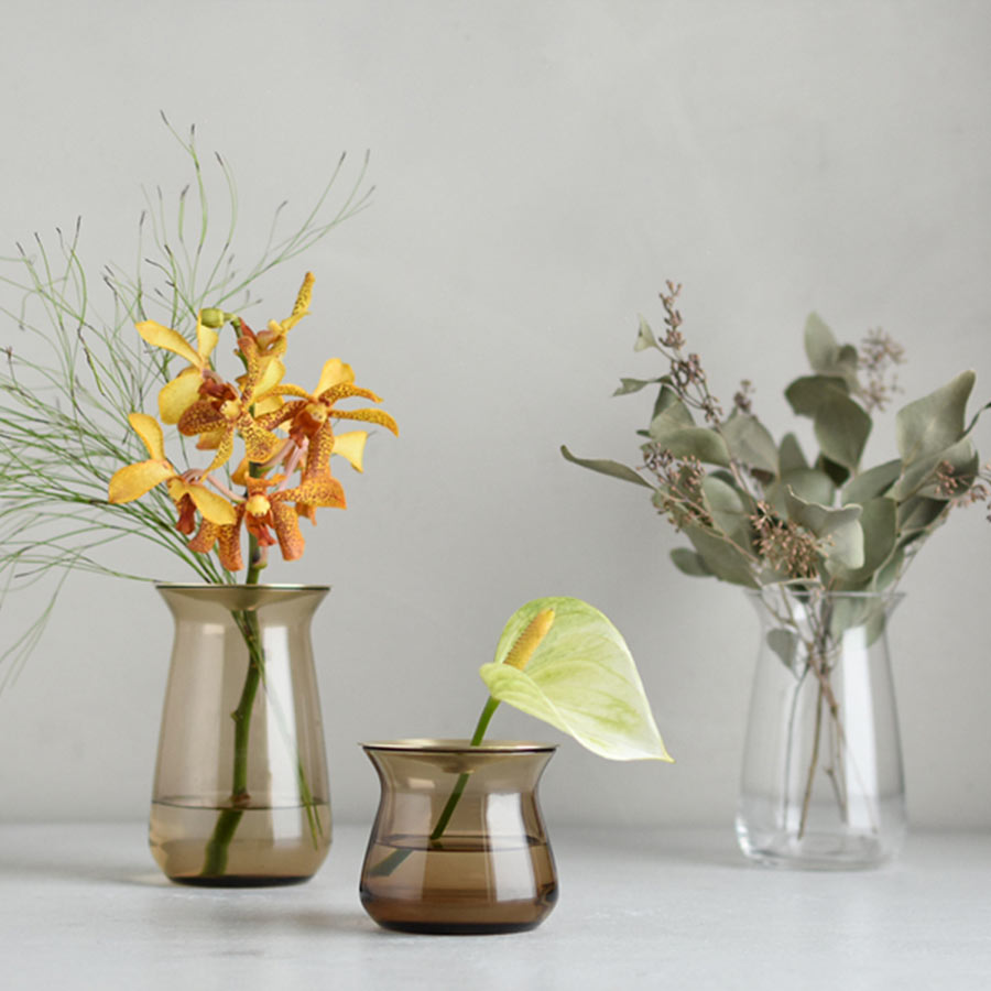  Three LUNA vases with assortment of flowers on a counter top  