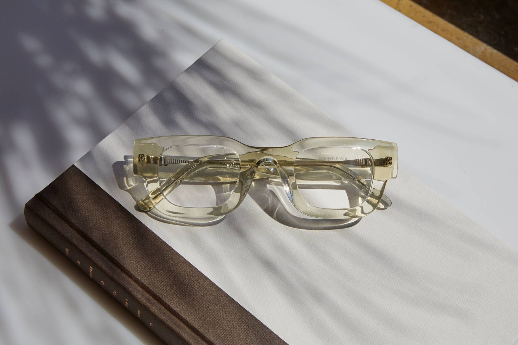 Photo Details of Valentin Blue Light Clear Mocha Blue Light Glasses in a room