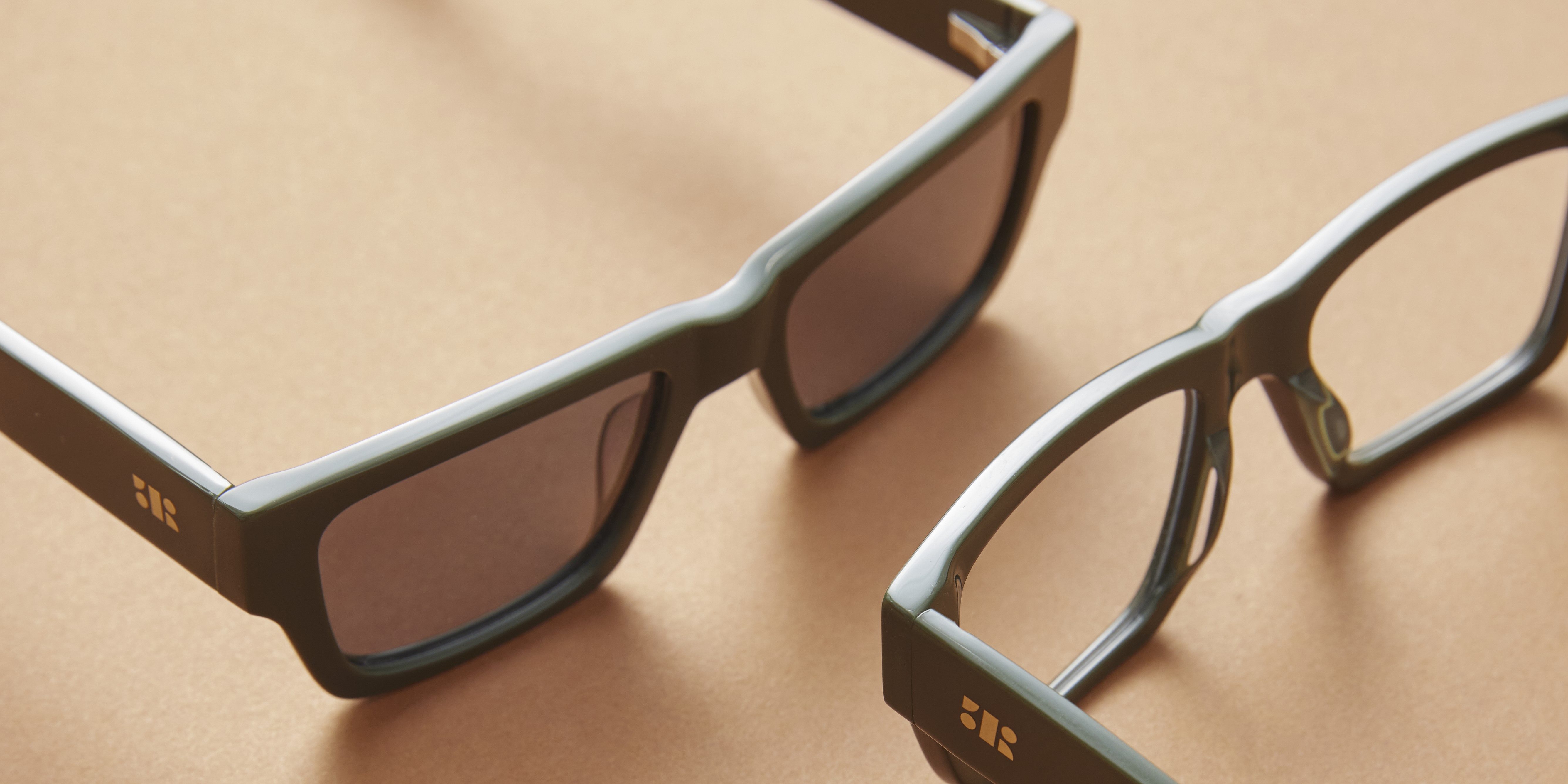 Photo Details of Aimé Sun Clear Dark olive Sun Glasses in a room
