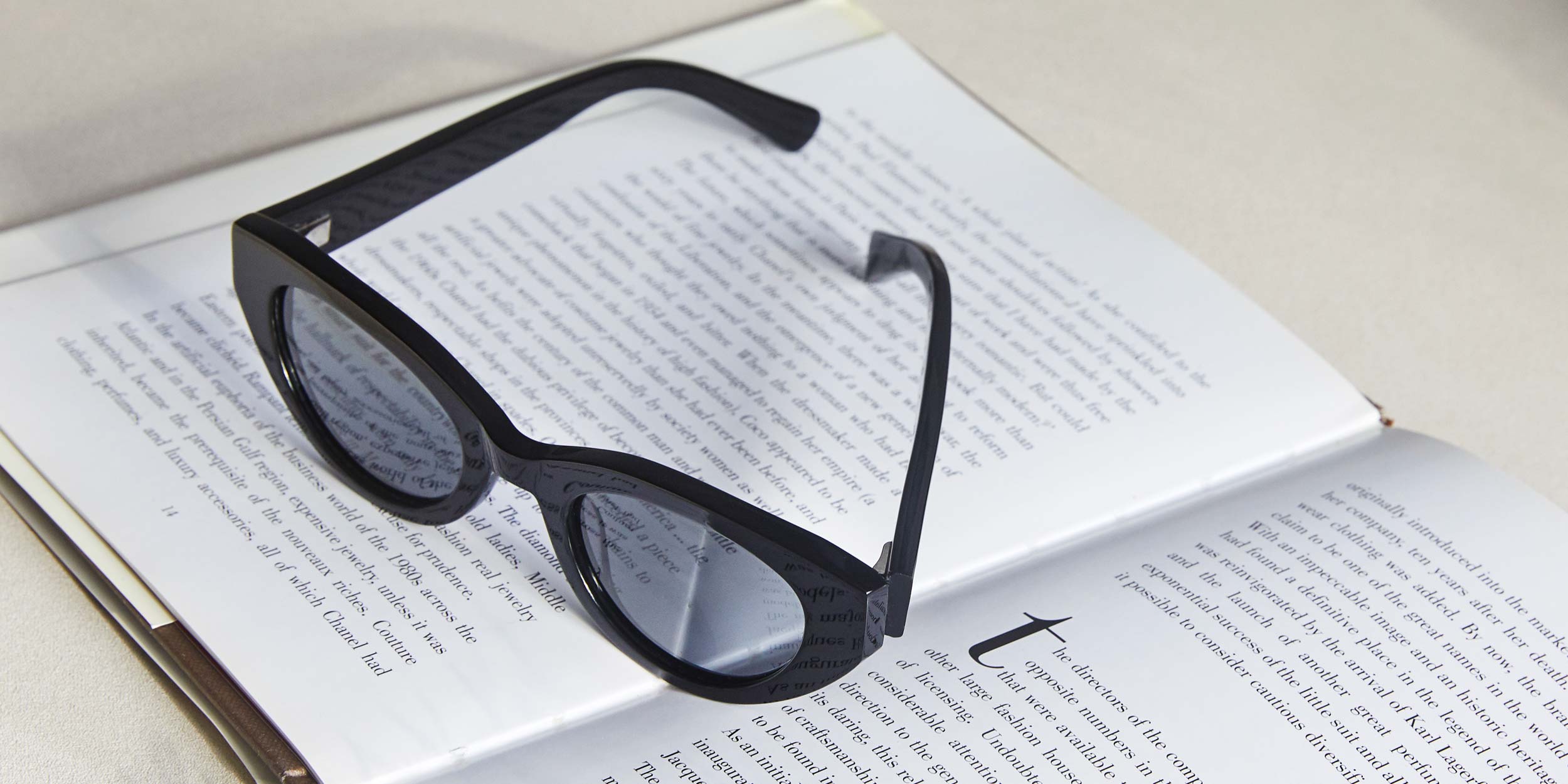 Photo Details of Camille Sun Havana Tortoise Sun Glasses in a room
