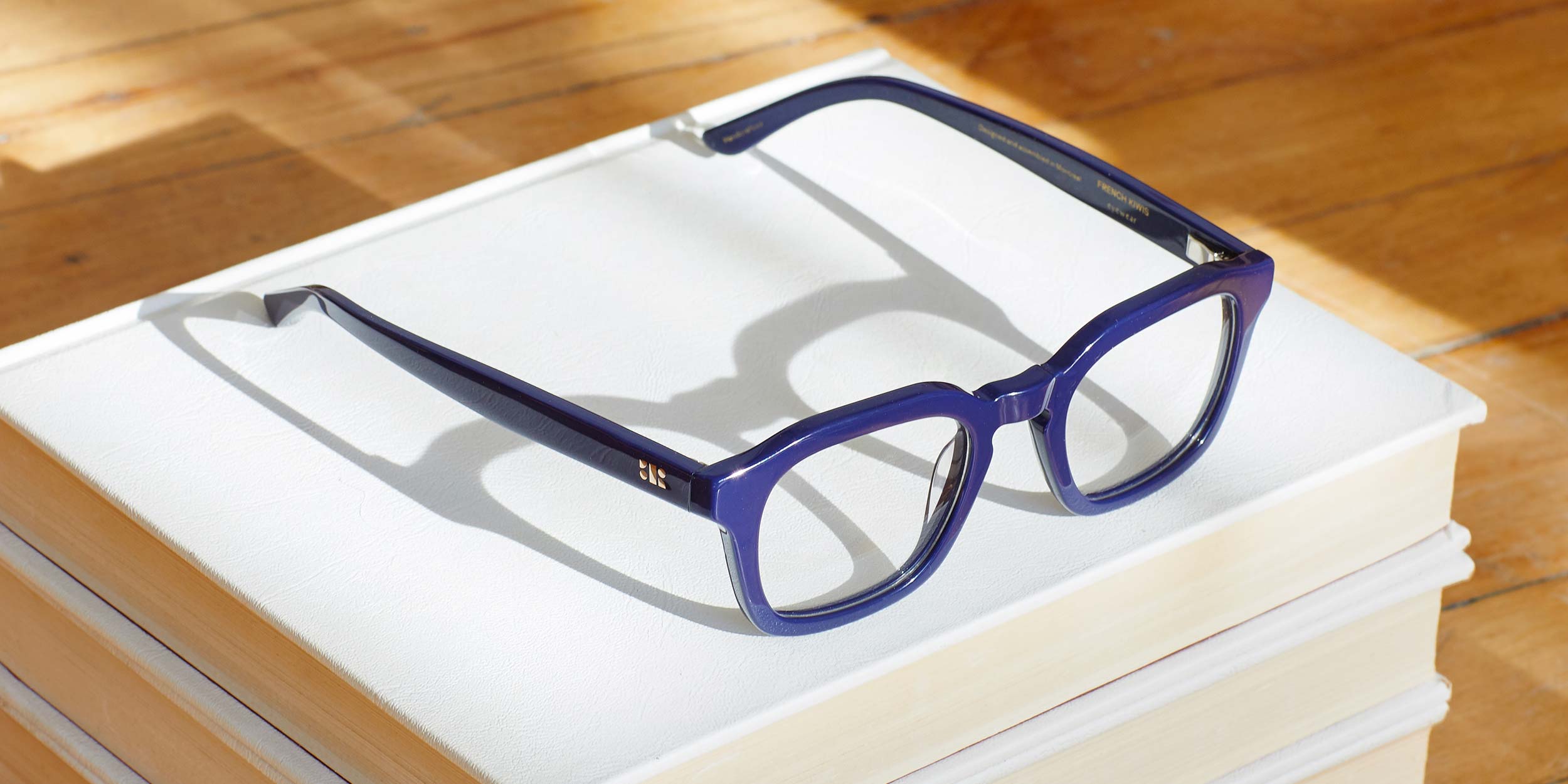 Photo Details of Oscar Blue Light Clear Dark Olive Blue Light Glasses in a room