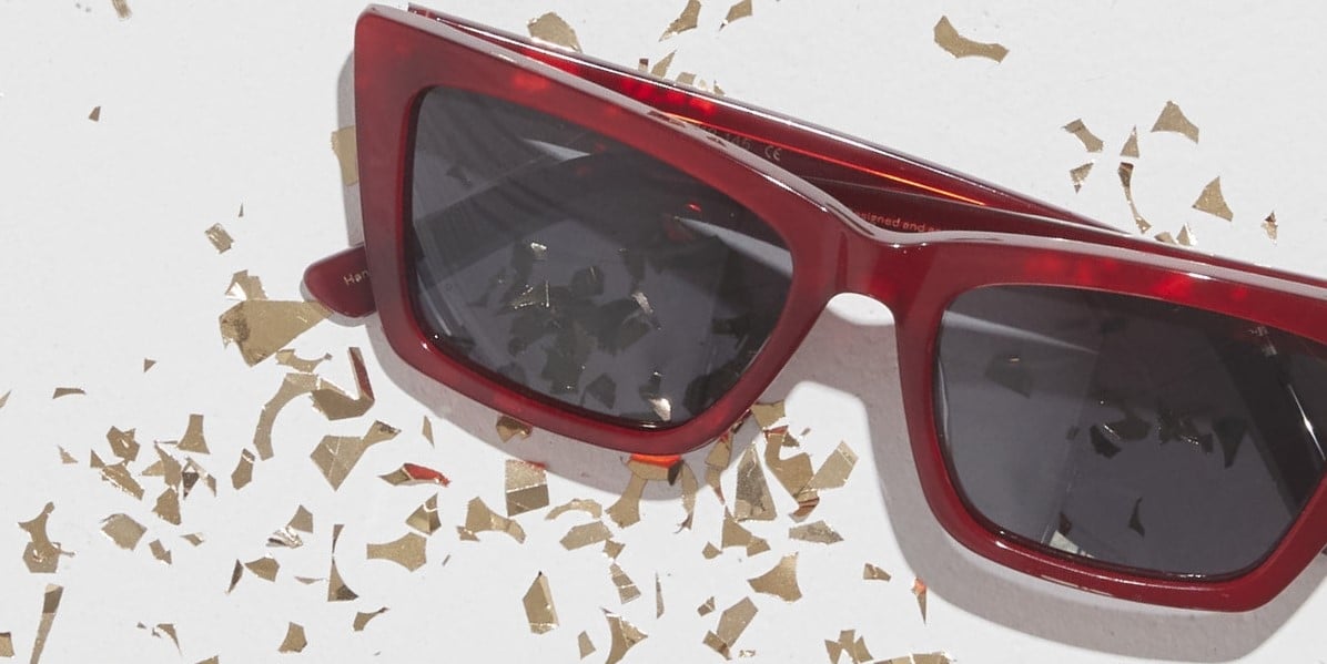Photo Details of Zoé Sun Sand Sun Glasses in a room