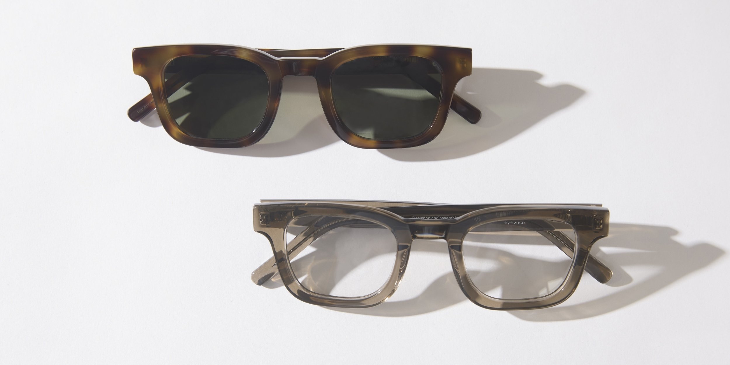 Photo Details of Émile Clear Dark Grey Reading Glasses in a room
