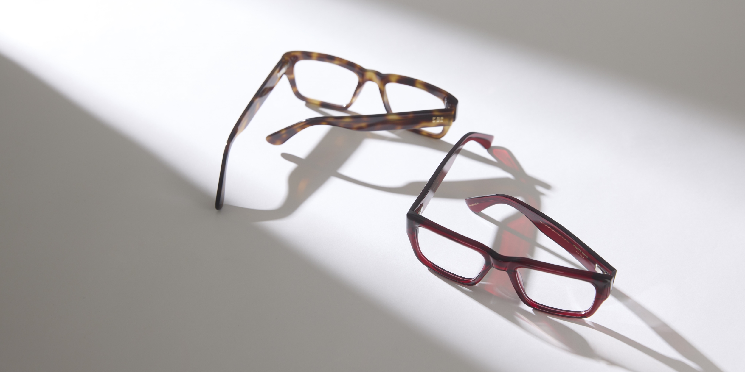 Photo Details of Henri Clear Dark Olive Reading Glasses in a room
