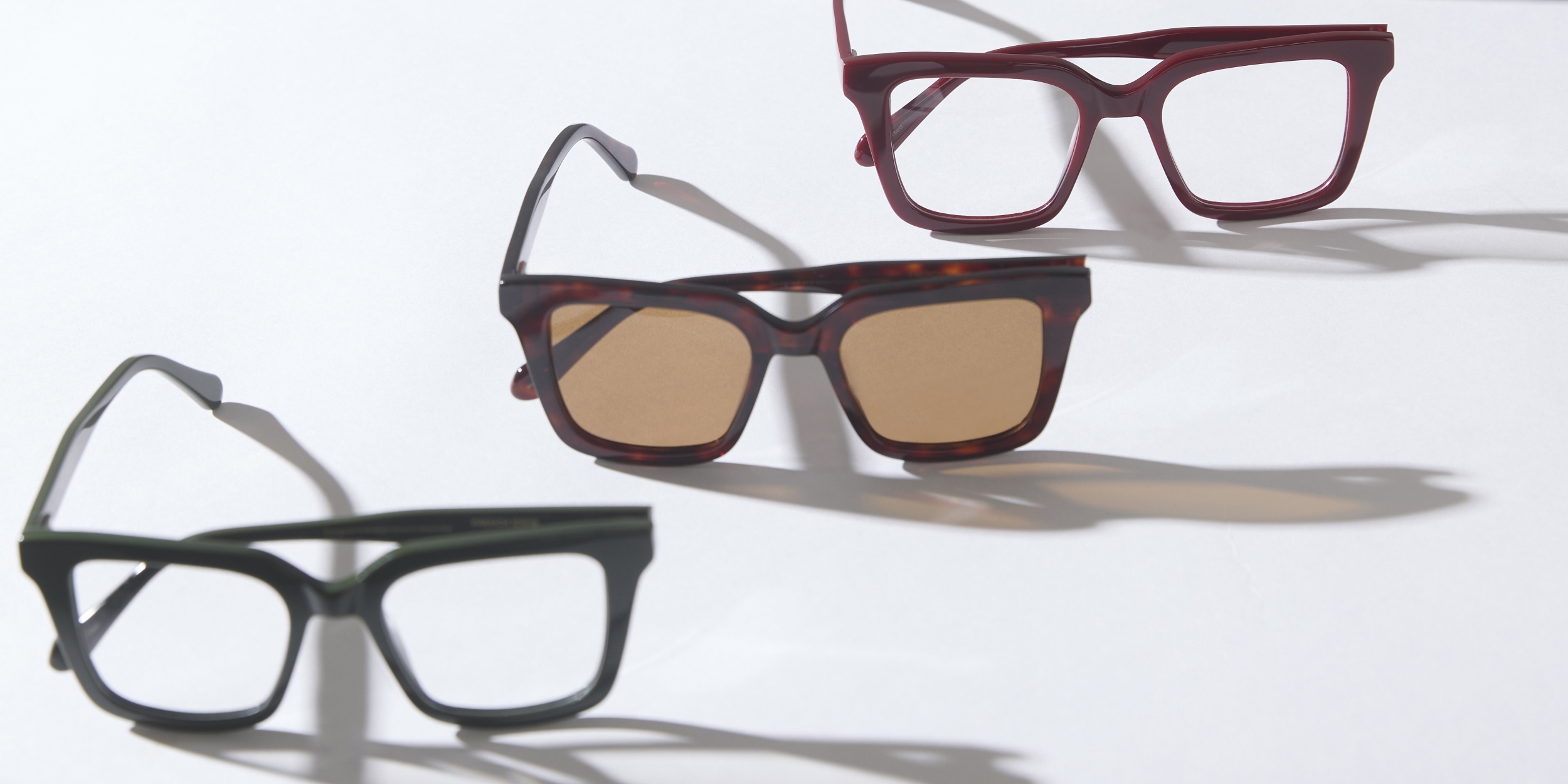 Photo Details of Jolie Blue Light Dark Red Blue Light Glasses in a room
