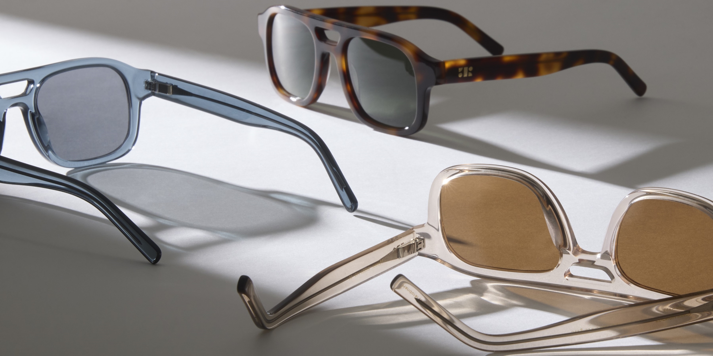 Photo Details of Lenny Sun Clear Brown Sun Glasses in a room