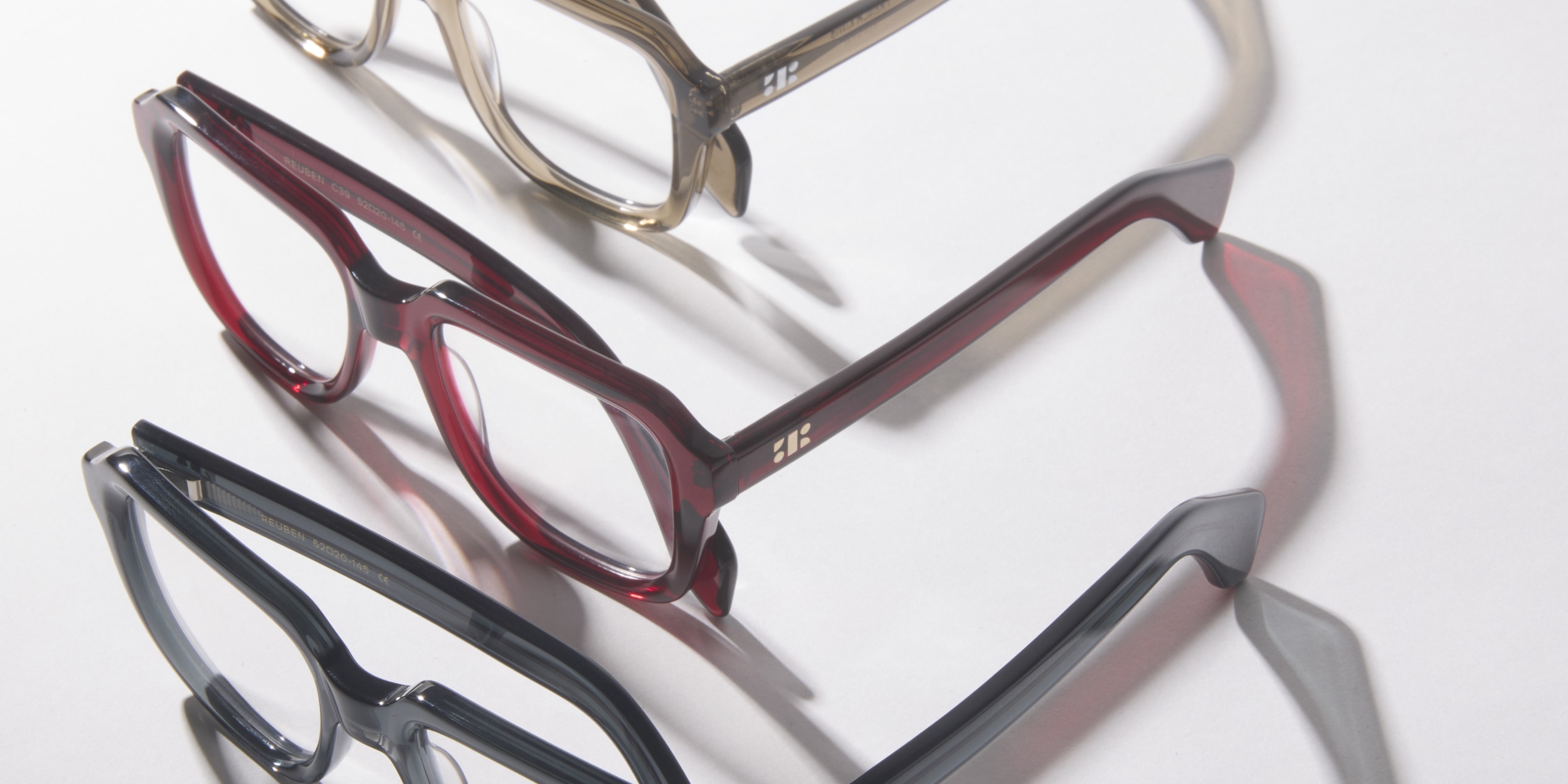 Photo Details of Reuben Blue Light Clear Taupe Blue Light Glasses in a room