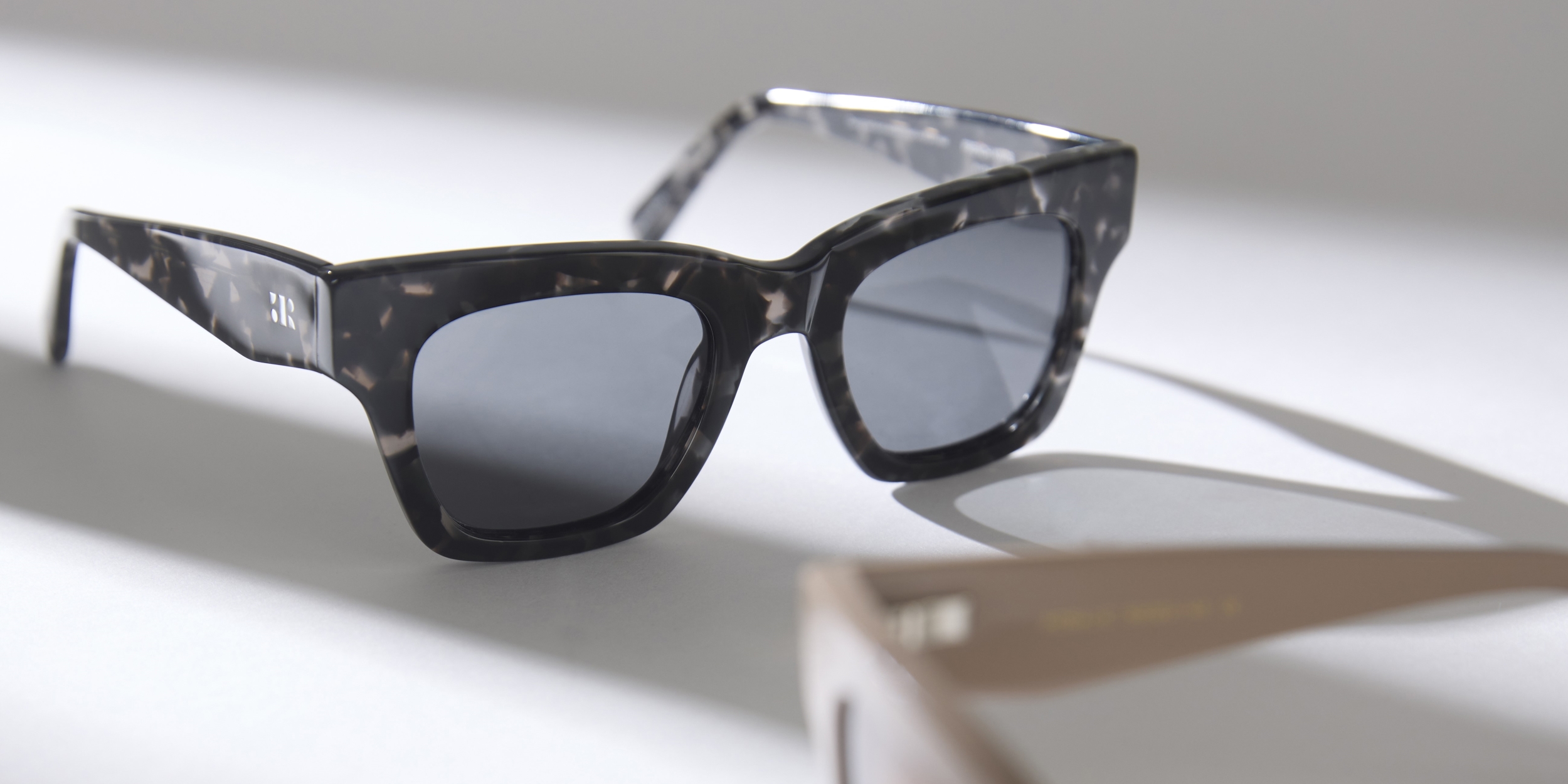 Photo Details of Rosalie Sun Cream Sun Glasses in a room