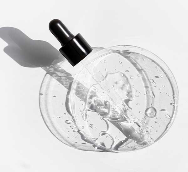Synergie Skin product dropper showing texture of serum