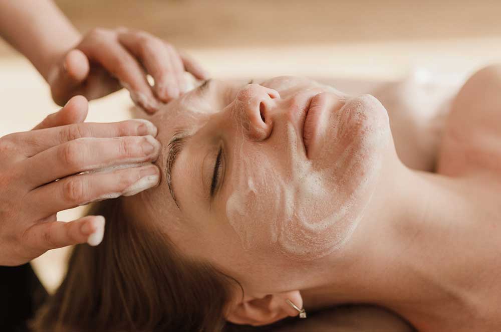 Woman receiving a professional facial treatment