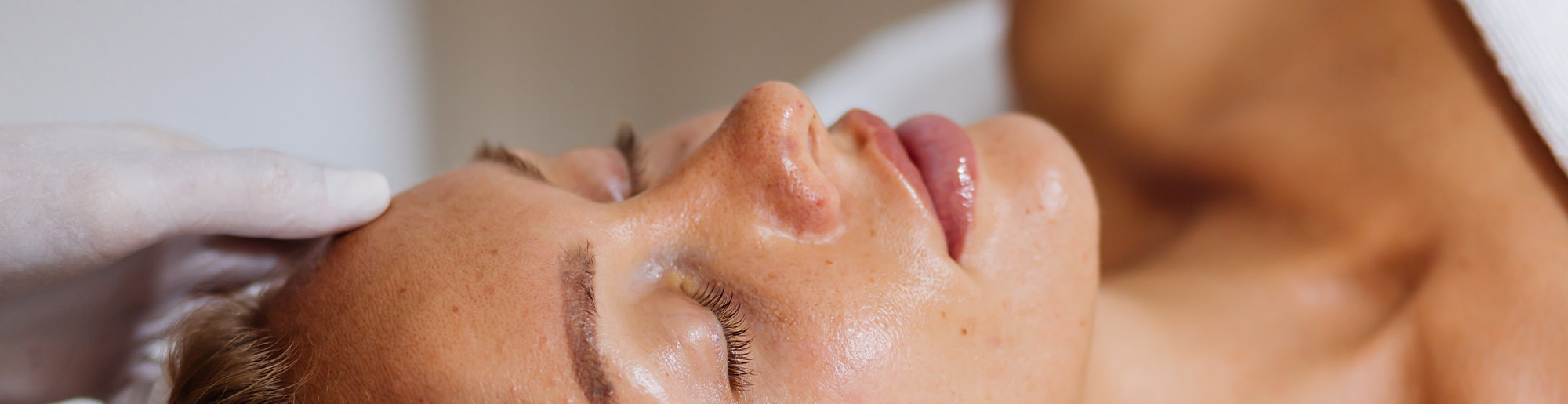 Woman lying down during a professional skin treatment