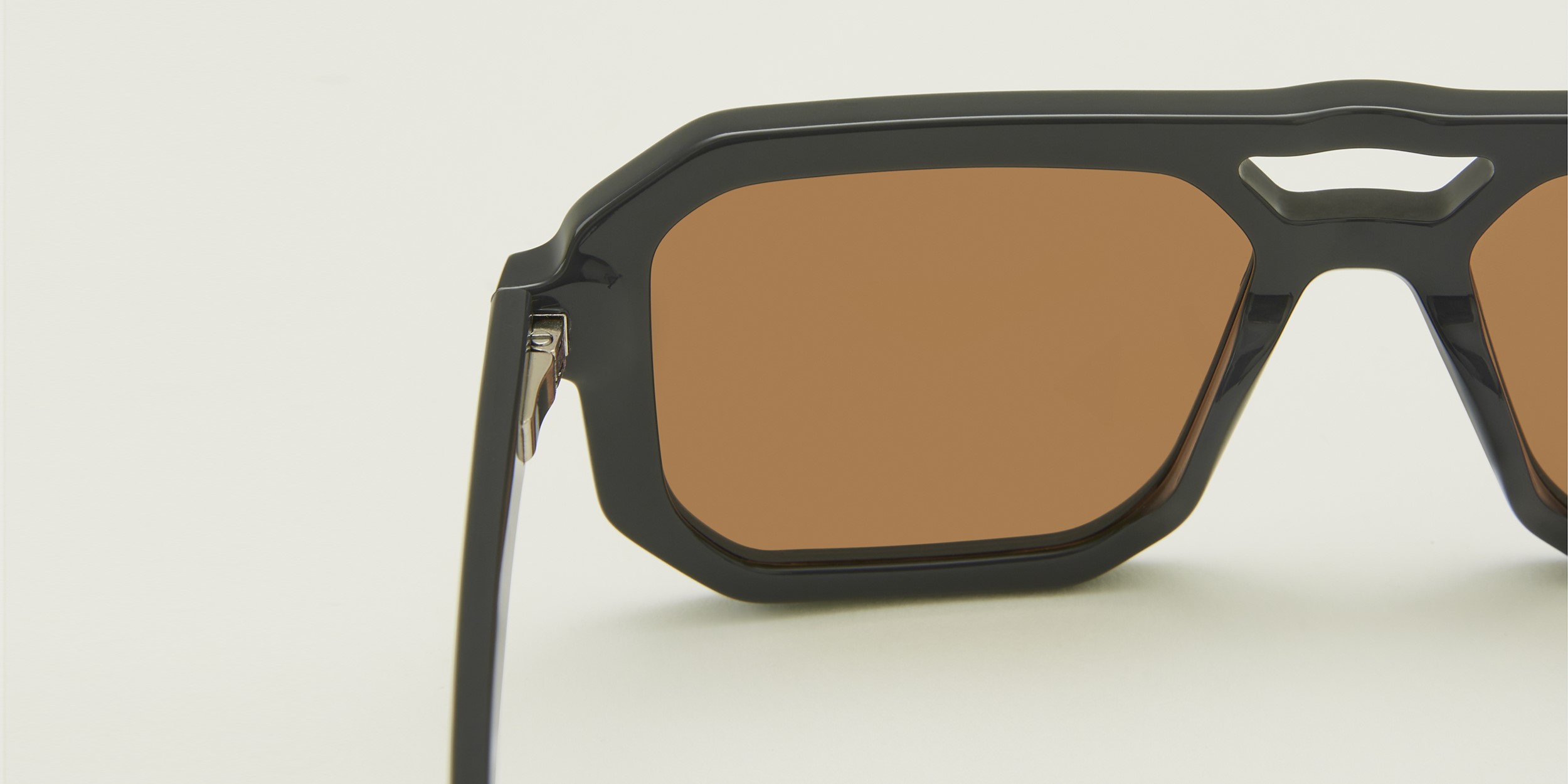 Photo Details of Angelo Sun Cream Sun Glasses in a room