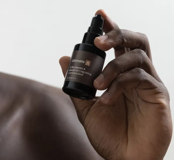 Model holding Vitamin A by Synergie Skin