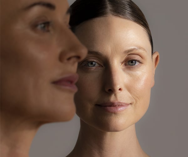 Two skincare models standing together
