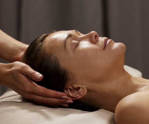 Model getting a head massage