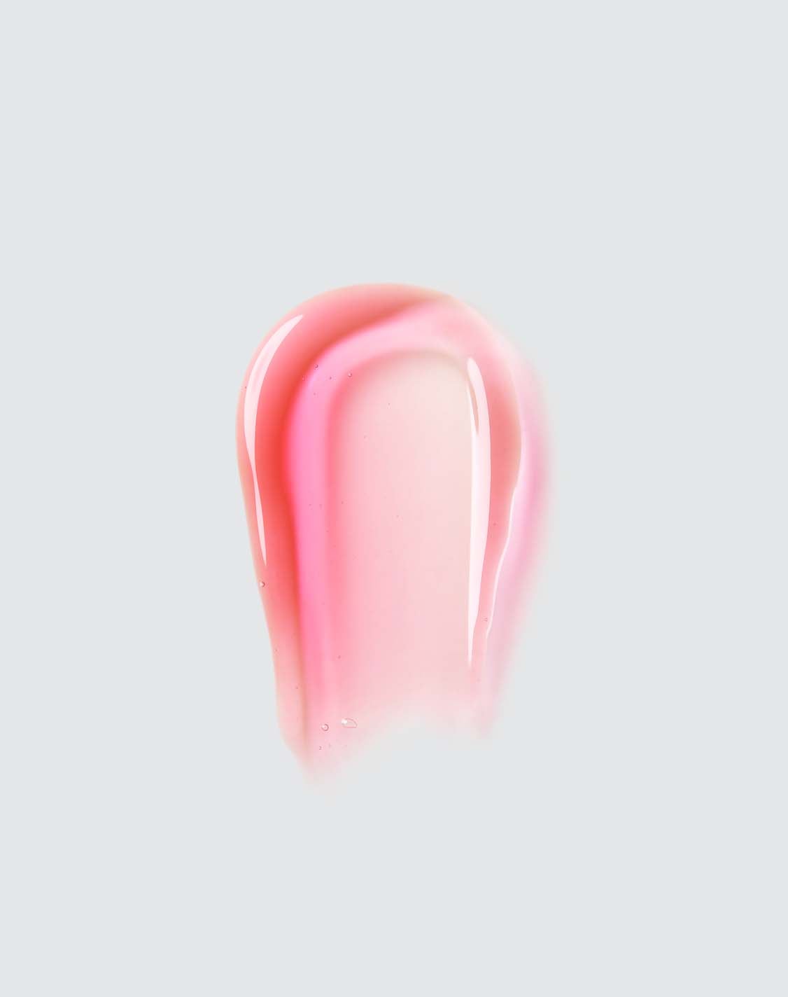 Kids Tinted Lip Oil - Pink Stardust spread to highlight its texture