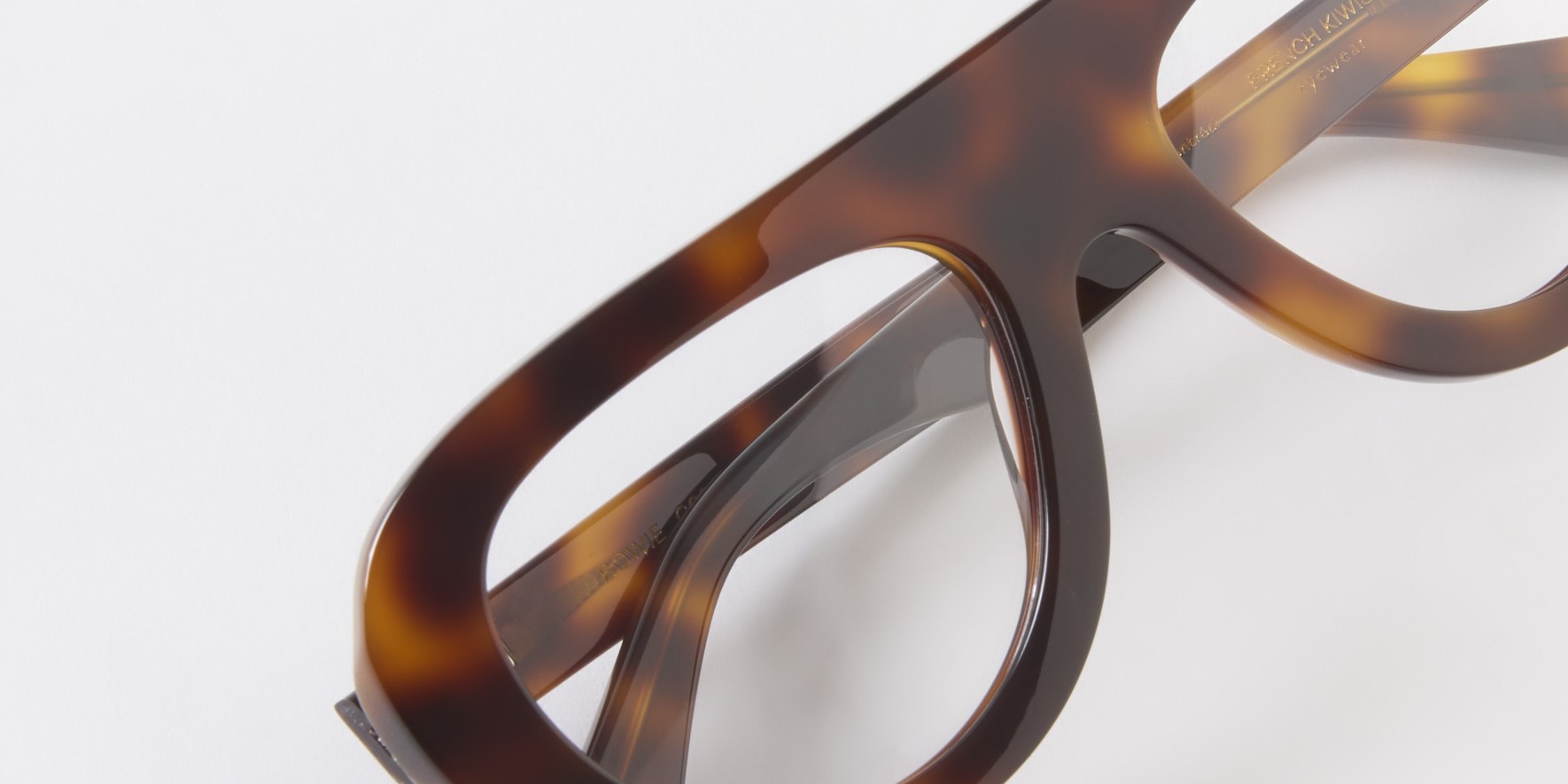 Photo Details of Bowie Clear Mint Reading Glasses in a room