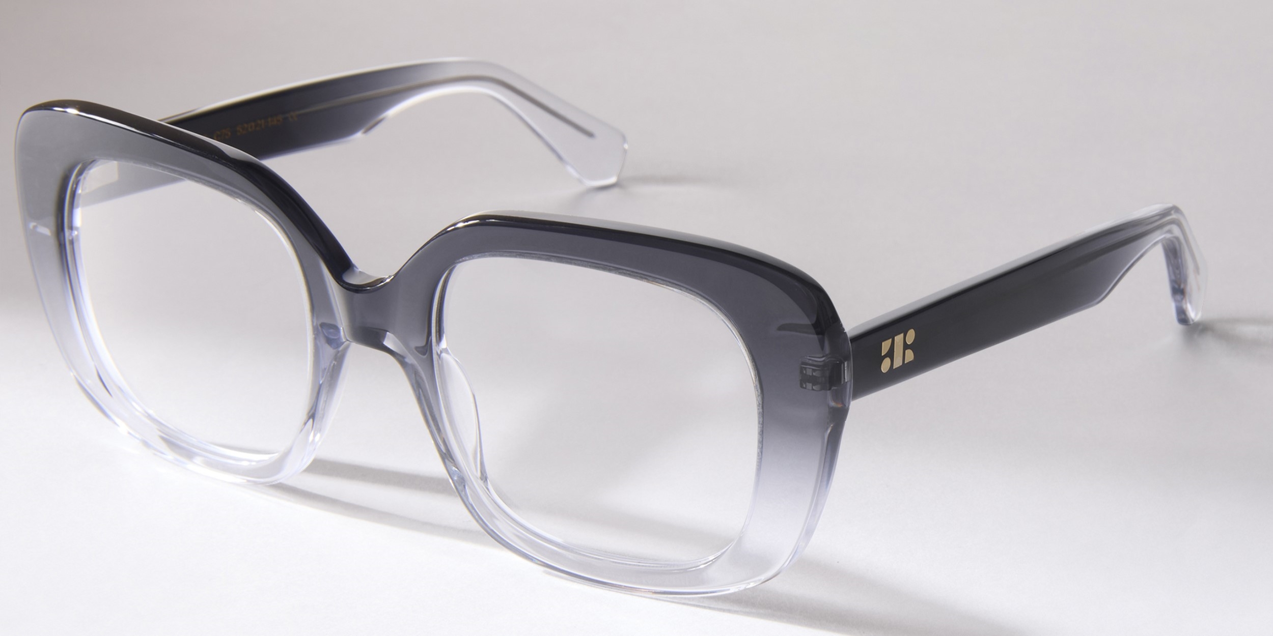 Photo Details of Celeste Gradient Chocolate Brown Reading Glasses in a room