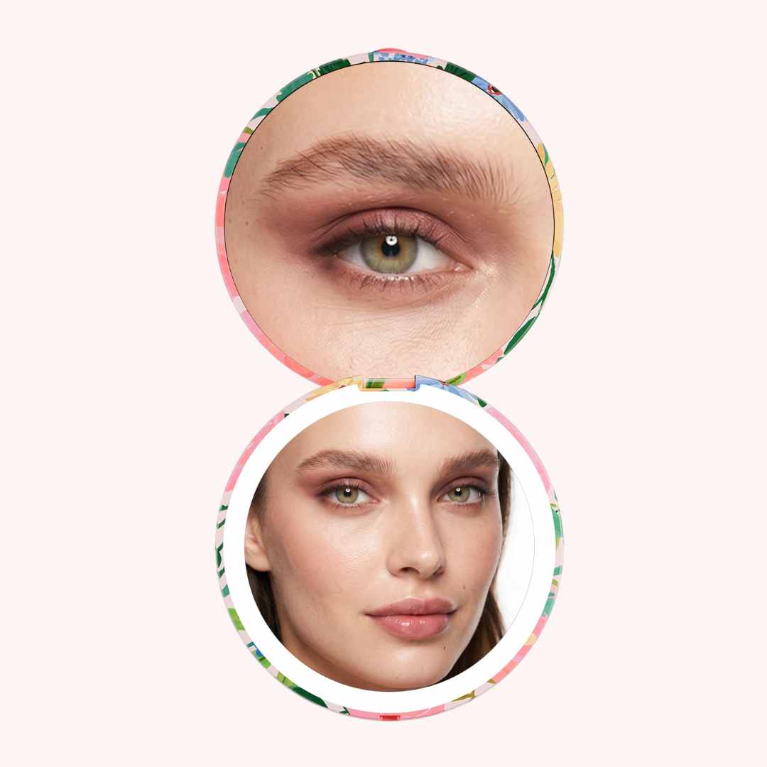 Woman looking in Vibrant Florals Mini Taylor with 10x and 1x Magnifcation