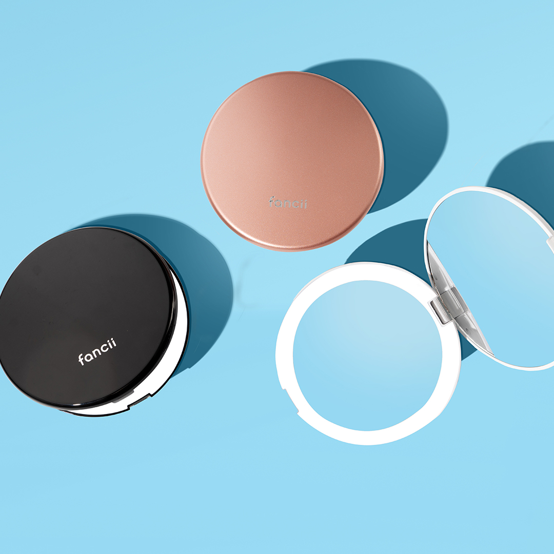 Lumi lighted compact with 1X and 10X magnifying mirrors in black, rose gold and white