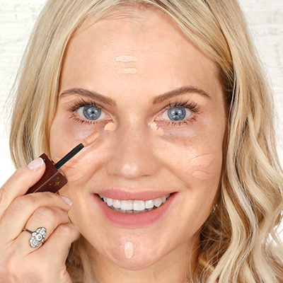 Apply a tiny dot to any areas that need coverage
