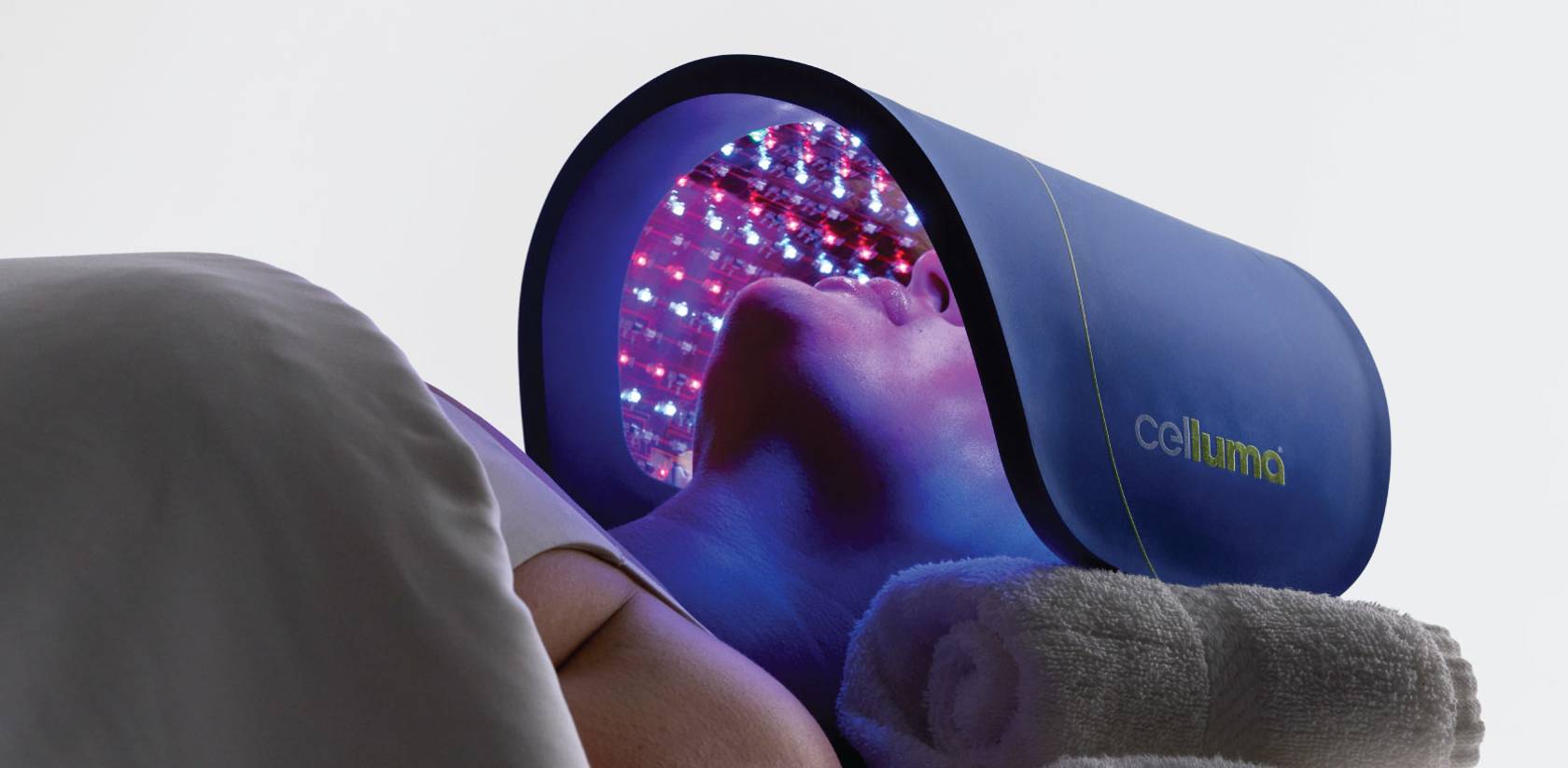 Celluma LED light therapy device being used to treat a person's face