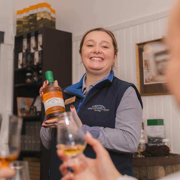 A Tobermory Distillery Tour Guide leading a whisky tasting.