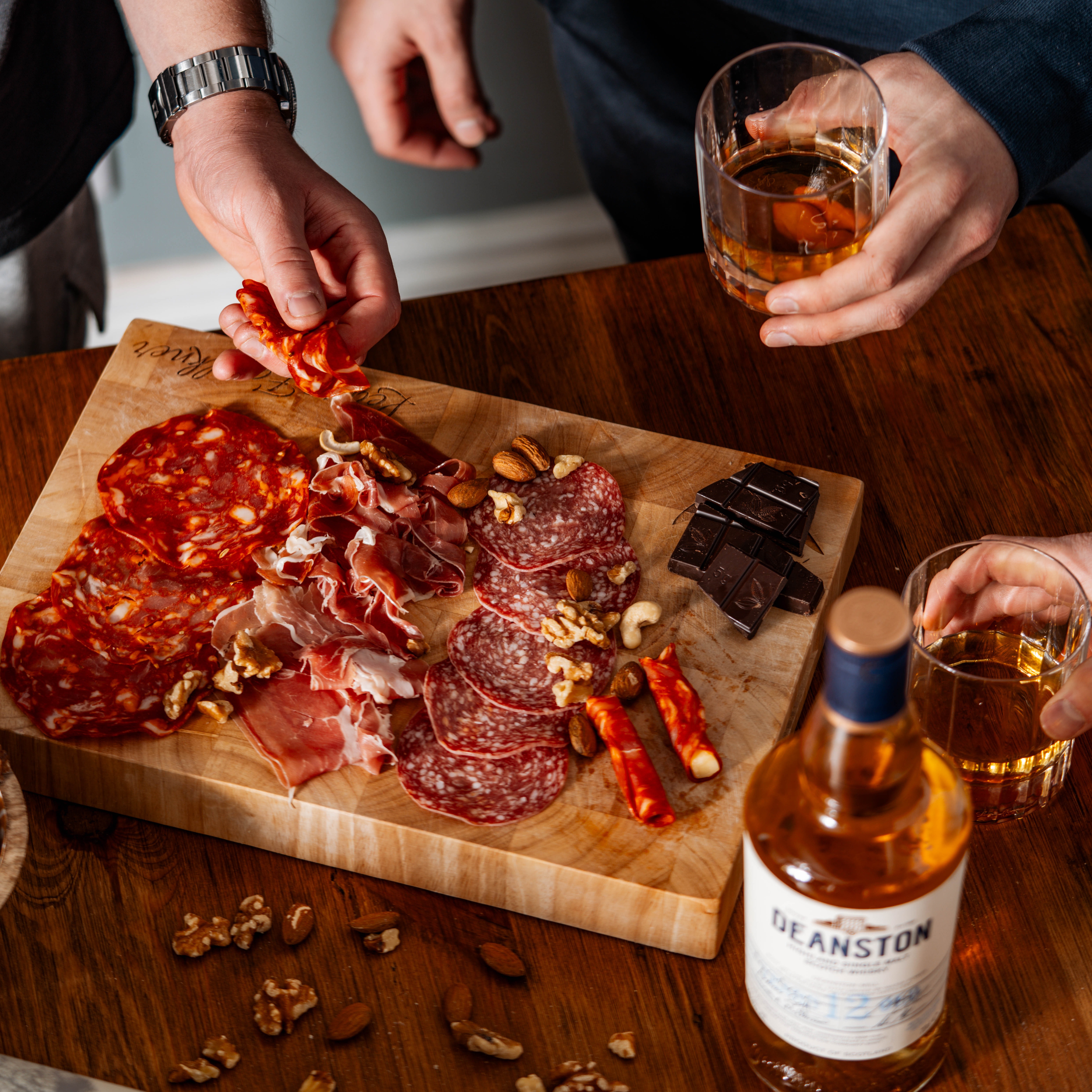 People enjoying a dram of whisky and food pairings