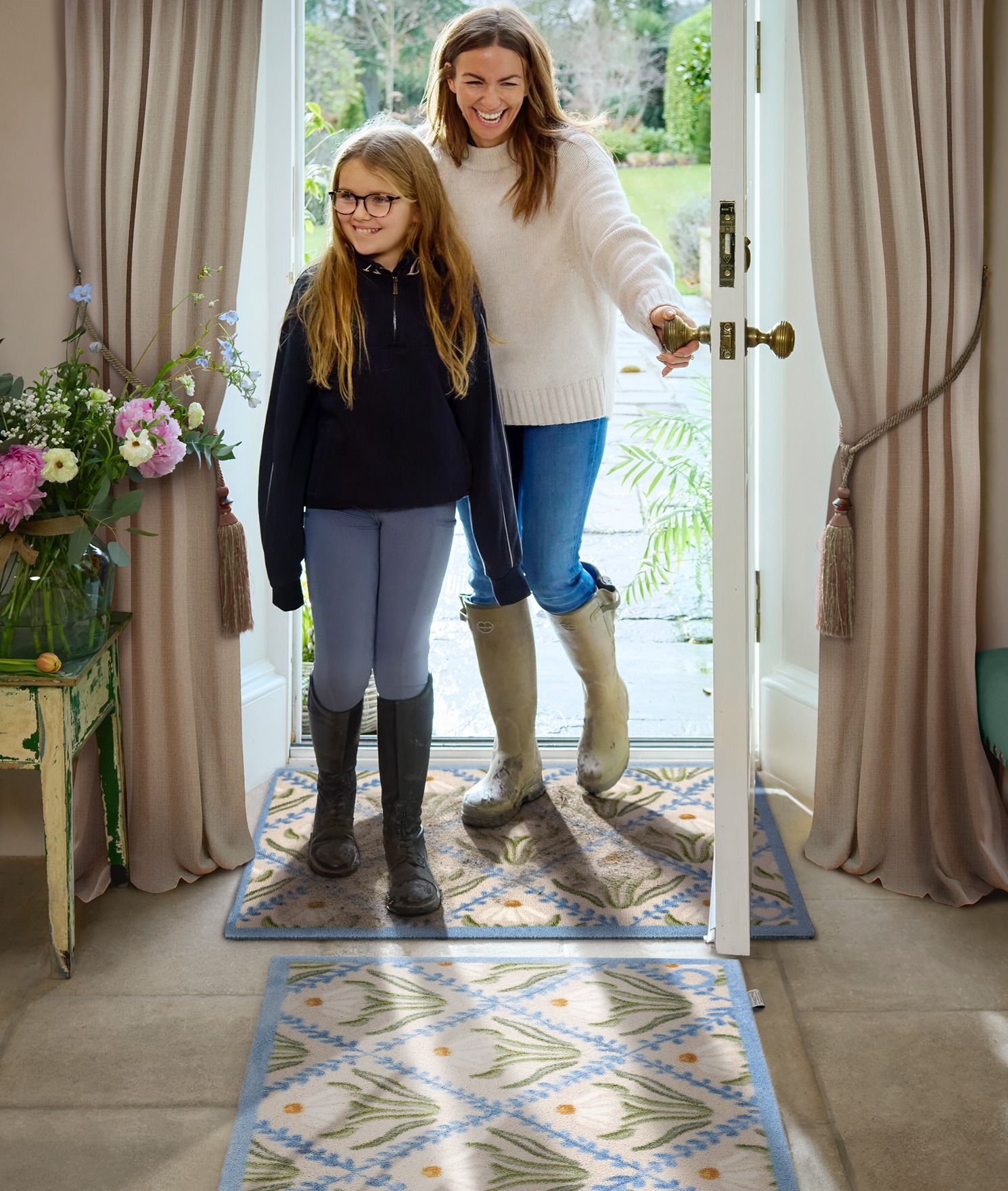 Daisy Trellis Washable Doormat and Runner, styled in a entryway. 