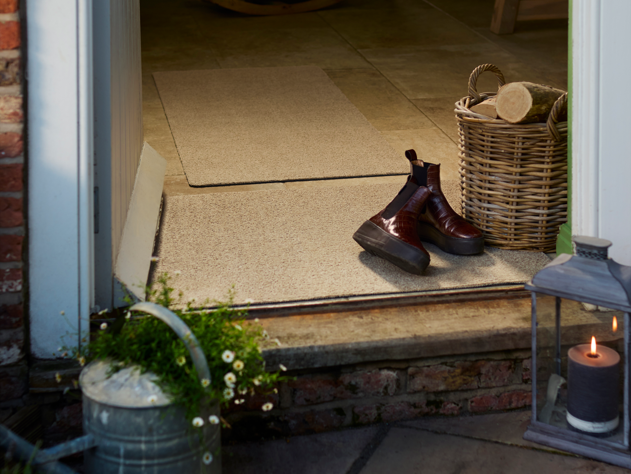 Plain Fleck Beige Washable Doormat and Runner, styled in a doorway. 