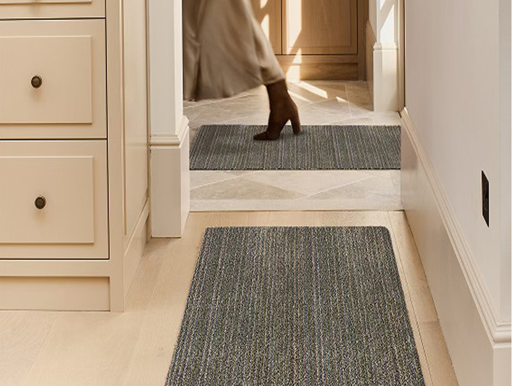 Candy Stripe Washable Doormat and Runner styled in a hallyway.