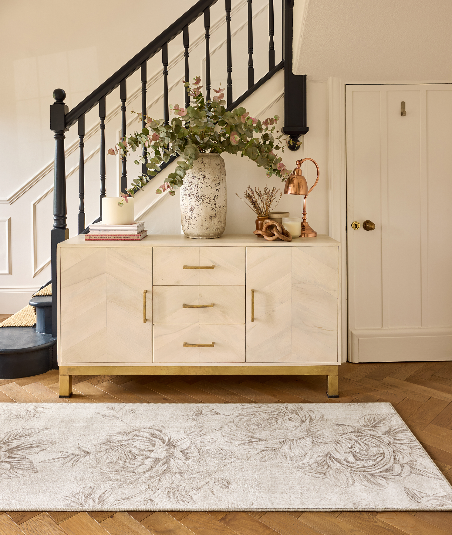 Muted Floral Beige Eco-Washable Runner, styled by the stairs.